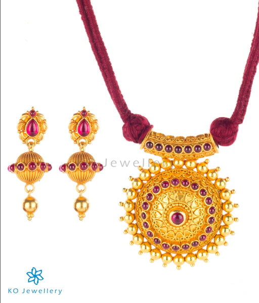 Temple jewellery set with resplendent sun-shaped pendant
