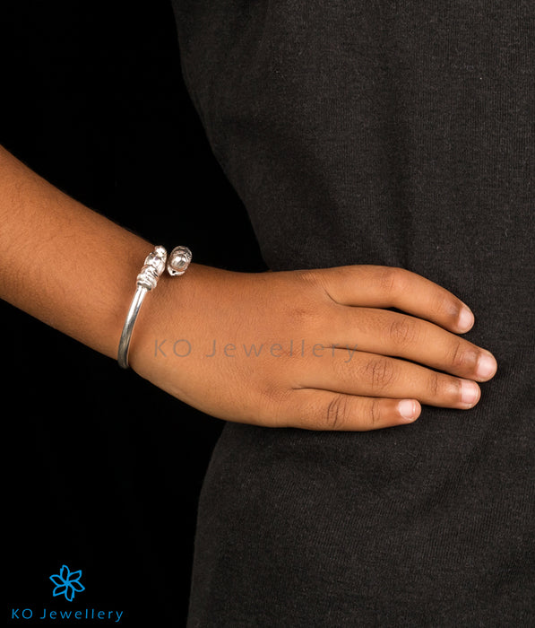 How can a baby bangle or bracelet be worn as a child grows.