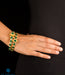 gold plated silver bangles with green gemstones