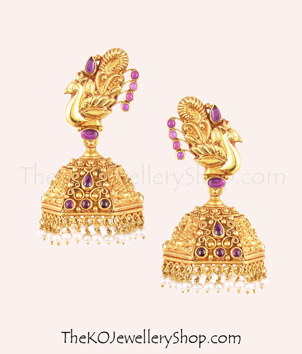 Intricate peacock-motif gold-plated temple jewellery jhumkas
