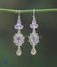 Silver and gem-studded elegant earrings for work